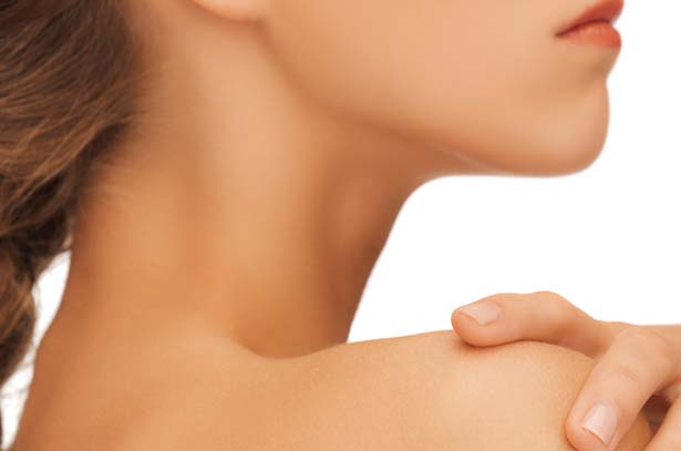 Side profile of a young woman's chin.